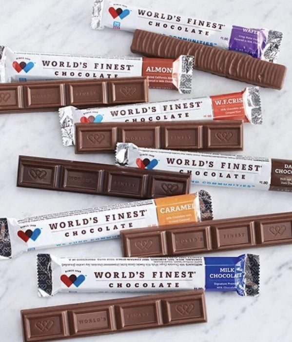 Assorted chocolate bars with visible branding on a marble surface